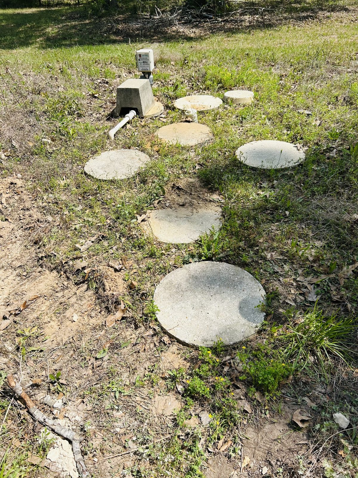 Aero-Stream Eco-Nest aerobic system concrete lids in yard